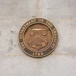 depositphotos_29319711-stock-photo-seal-on-treasury-building-washington